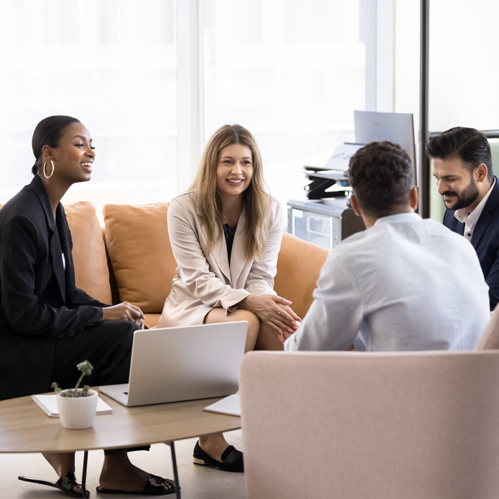 happy staff talking at connected meeting room