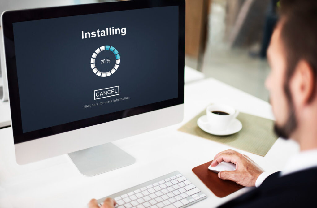 Man updating his desktop computer