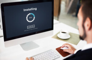 Man updating his desktop computer